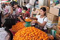 MYANMAR / Yangon / 2015 / Selling fruits in front 