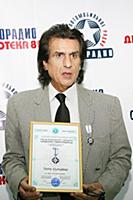 Итальянский певец Тото Кутуньо.